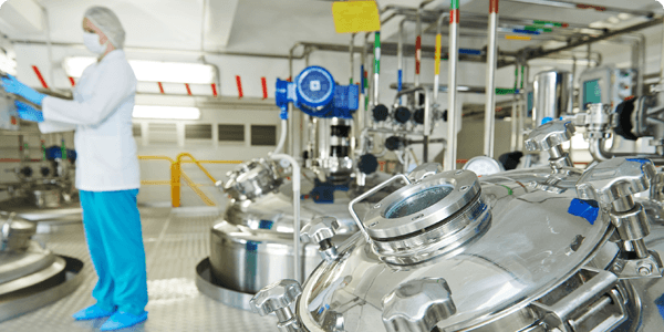 Technician working in a pharmaceutical manufacturing facility
