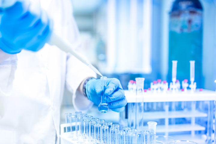 Technician using a pipette