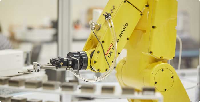 robot in mass calibration lab